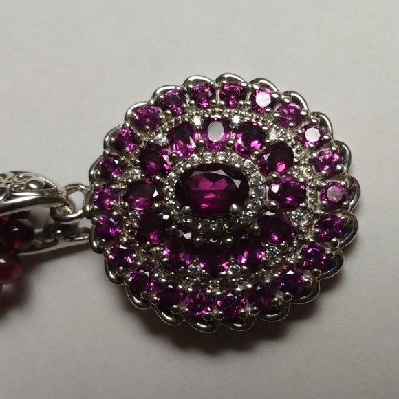Stamped .925 Orissa Rhodolite Garnet, Sapphire and Diamond...